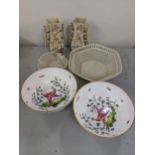 Two Belleek lattice pierced bowls, together with two porcelain bowls decorated with peacocks and