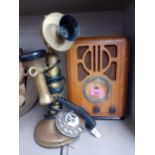 A reproduction wooden cased radio and a reproduction brushed brass telephone, and a 20th century
