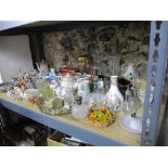 A mixed lot to include cut glass decanters and stoppers, scent bottles to include a silver capped