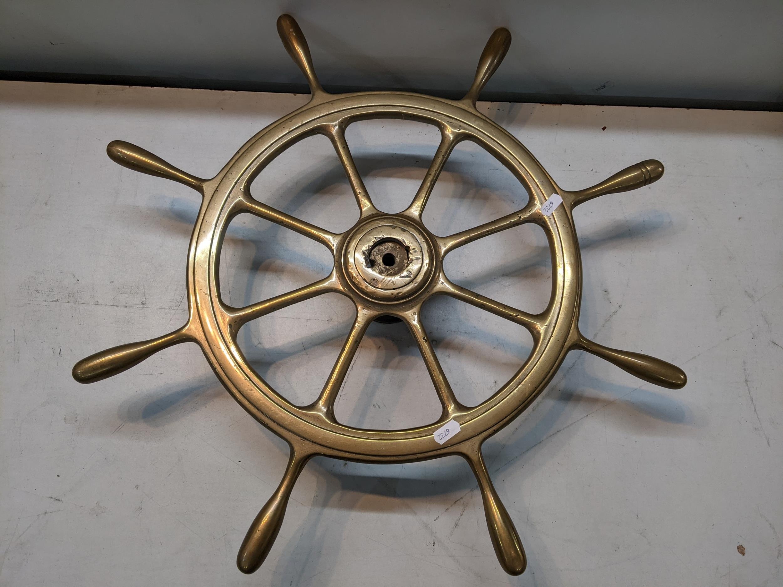 A 20th century brass eight handled ships wheel Location: