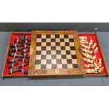 A modern Chinese chess set, having a carved border and engraved brass handles Location: