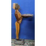 An Art Deco carved treen figural card holder on a raised base and turned feet, 89h Location: