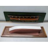 Two half hull of ships mounted on a wall hanging plaques, on inscribed 'Geo Partis & Son, Ship-