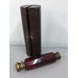 A Victorian ruby glass double ended scent bottle with silver plated caps, in a fitted case Location: