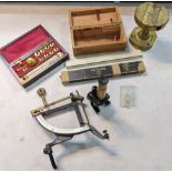 A collection of scientific equipment to include concave letter scales, a boxed microscope and
