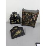 Black lacquered papiermache comprising a pair of wall pockets, and a table top cabinet Location: