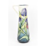 A Moorcroft pottery 'Iris' jug, designed by Rachel Bishop for the Moorcroft Collectors Club 1996, of