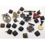 Mixed WWII and other badges to include Nursing Cross, 1939 iron cross and other WWII German style