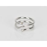 Georg Jensen- An 18ct white gold and diamond 'magic' ring, designed by Regitze Overgaard, with a