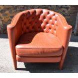 A mid century Italian leather tub chair by Minotti, designed by Rodolfo Dordoni, in red leather with