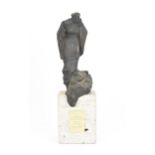 A Spanish contemporary cast bronze sculpture on stone stand, modelled as a hunched figure in a