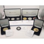 A collection of boxed Jubilee mint silver and other commemorative coins to include The Centenary