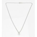An 18ct white gold and diamond solitaire pendant on chain, the brilliant cut stone approx 0.40
