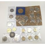 A mixed collection of coins to include Beatrix Potter 50 pence, Paddington and others along with a