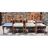 A matched set of Gordon Russell chairs, each in the same 'Burford' design with stick back, to
