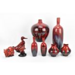 A collection of Royal Doulton Flambe porcelain, to include three animal models and six various sized