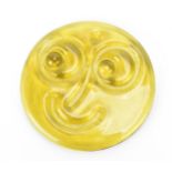 A rare Whitefriars glass smiley face suncatcher, designed by Alfred Fisher, in translucent yellow