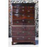 A George III mahogany chest on chest, with moulded cornice, chamfered reeded corners, with three