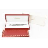 A Must De Cartier Diabolo Stylo ballpoint pen, in platinum coloured mount,, cartridges, with