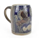 An English salt-glazed pottery tankard, in the style of Doulton & Lambeth, with blue glazed ground