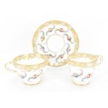 An early 19th century French porcelain teacup and saucer, circa 1830, with Sevres gilt interlaced