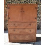 A Heals limed oak cabinet, circa late 1930s, designed with forged iron exposed cabinet door