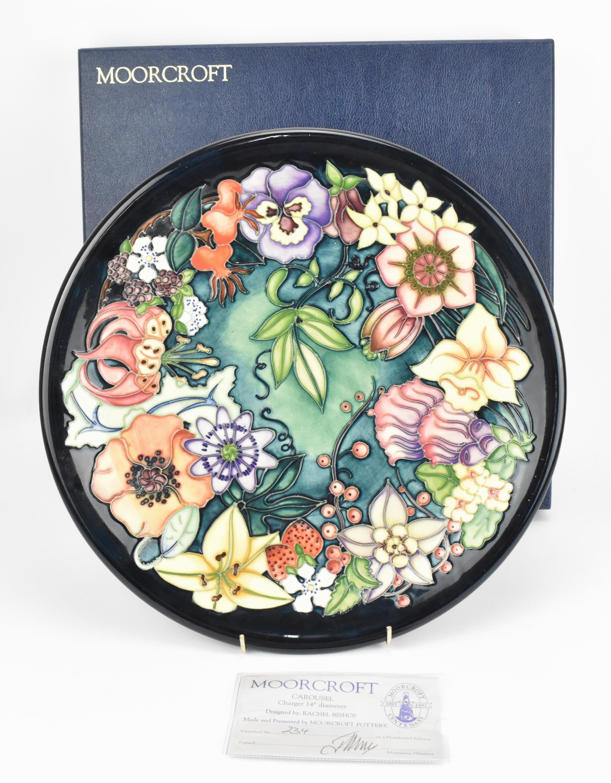 A Moorcroft pottery 'Carousel' charger designed by Rachel Bishop, painted by Sharon Austin, 1996,