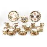 A Royal Crown Derby Imari 2451 pattern tea set, 1925, comprising a teapot, milk jug, sugar bowl,