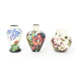 A collection of three small modern Moorcroft pottery vases, to include 'Satin Flower' designed by