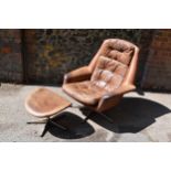 A 1960s brown leather swivel chair and ottoman, probably by H.M Klein for Bramin Møbler, 88 cm