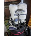 A golf bag containing a selection of Yonex ADX FL100 irons and Calloway drivers Location: