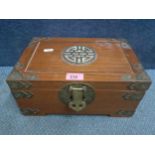 A 20th Century Chinese hardwood jewellery box having brass mounts and brackets with the Chinese