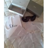 Christian Dior-A pair of brown mock tortoiseshell oversized sunglasses with branded sunglasses