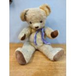A large Dean Rag Book Co vintage teddy bear with glass eyes Location: