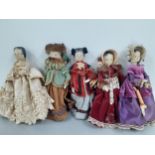 Five 20th Century painted wooden dolls dressed in the style of early 20th Century clothing A/F