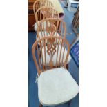 Four 20th century spindle backed elm and ash dining chairs with pierced backs with crinoline