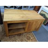 A modern mango wood two tier coffee table, 36cm h x 110.5cm w together with a matching cabinet, 53cm