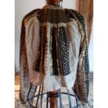 An early 20th Century Mediterranean light brown linen blouse with elaborate black and gold sequin