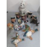 A mixed group of ceramic ornaments to include Royal Doulton character jugs, model of a cat,
