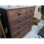 A Victorian oak flat fronted chest of two short, and four graduated long drawers, mahogany bun