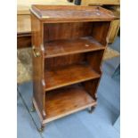 Mid 20th century four tier open bookcase of four turned legs and castors, 97cm h x 57cm w Location: