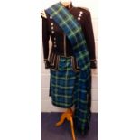 A green and blue tartan ladies kilt together with a Scottish Macleod black military style Royal