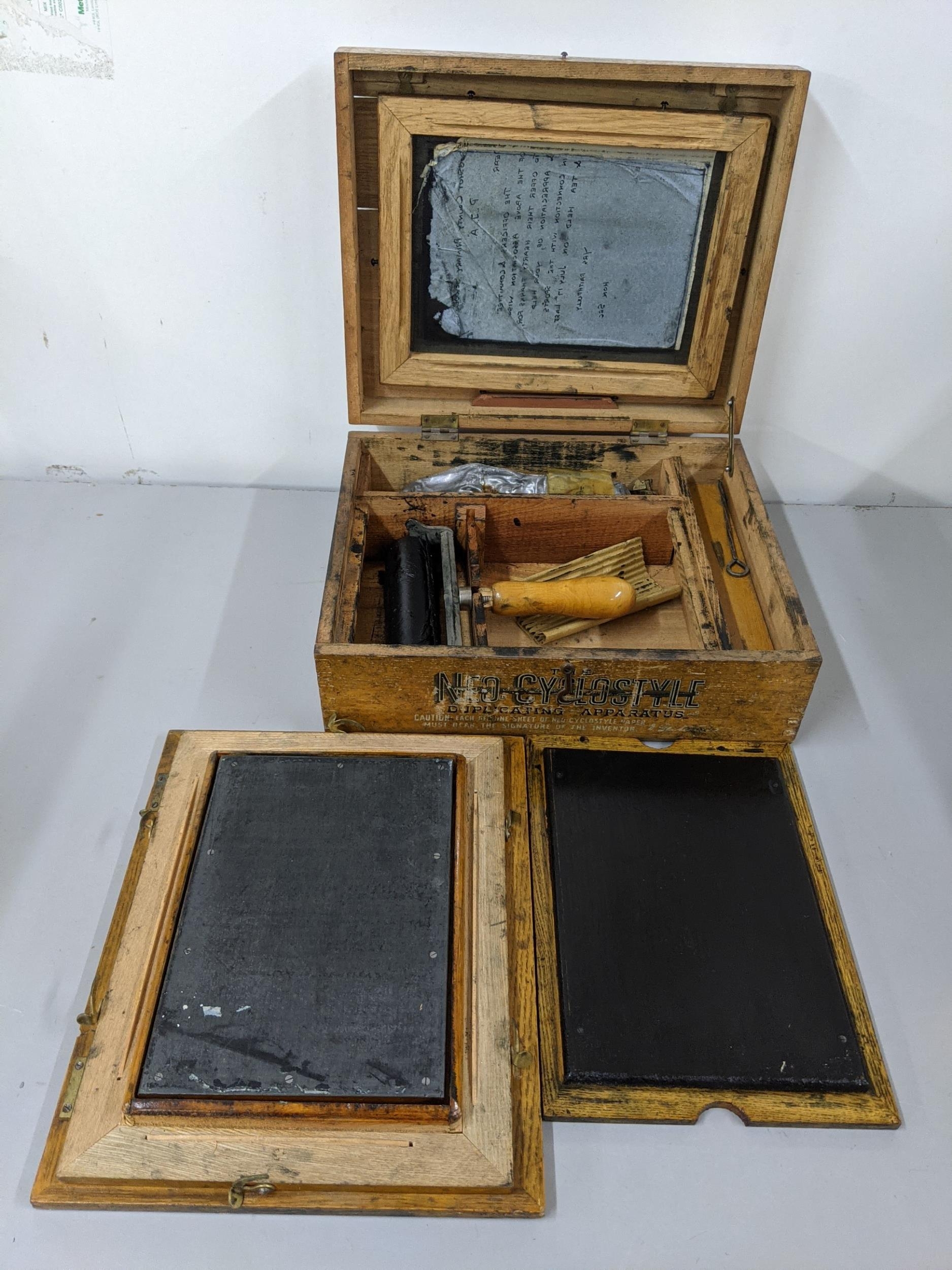 An early 20th century Neo Cyclost Duplicating apparatus, together with mixed pictures and prints