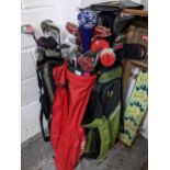 A group of three golf bags with a selection of golf clubs to include Trident Golf, Petron Lite