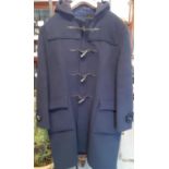 A vintage Gloverall gents navy woollen duffle coat with hood and horn shaped buttons, size 44"chest.