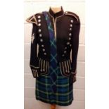 A green and blue tartan ladies kilt together with a green velvet waistcoat having diamond shaped and
