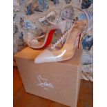 Christian Louboutin-A pair of pink beige 4" stiletto shoes having clear heel strap, leather ankle