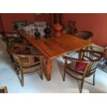A large Chinese hardwood dining table on square, tapered legs, 78cm high, 250cm long and a set of