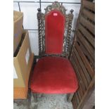An early Victorian Carolean style oak chair with red upholstery to back, and overstuffed seat