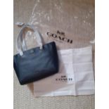 Coach-A brand new navy pebble leather tote handbag model number 57107 Turnlock with brushed grey